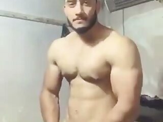Muscular fit solo middle eastern male stroking thick cock