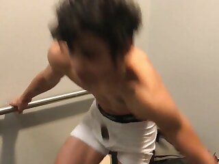 Cute Hipster is filmed jacking off in a department store fitting room.