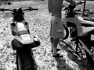 Watch this hot dude with his bike in motocross gear.