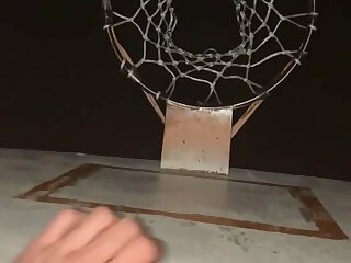 Cumming over basketball hoop